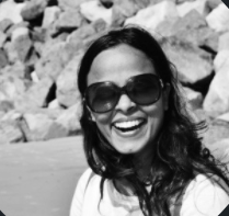 Priti Solanki smiling with rocky background